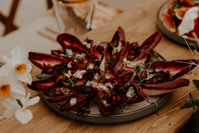 Red endive with blue cheese, pomegranate and candied walnuts
