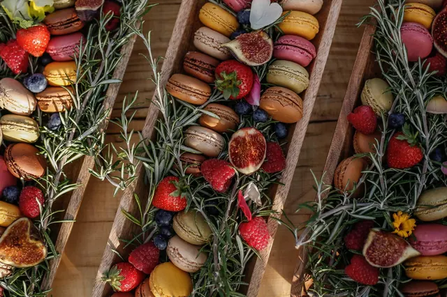 Macarons, figs and berries tucked into rosemary