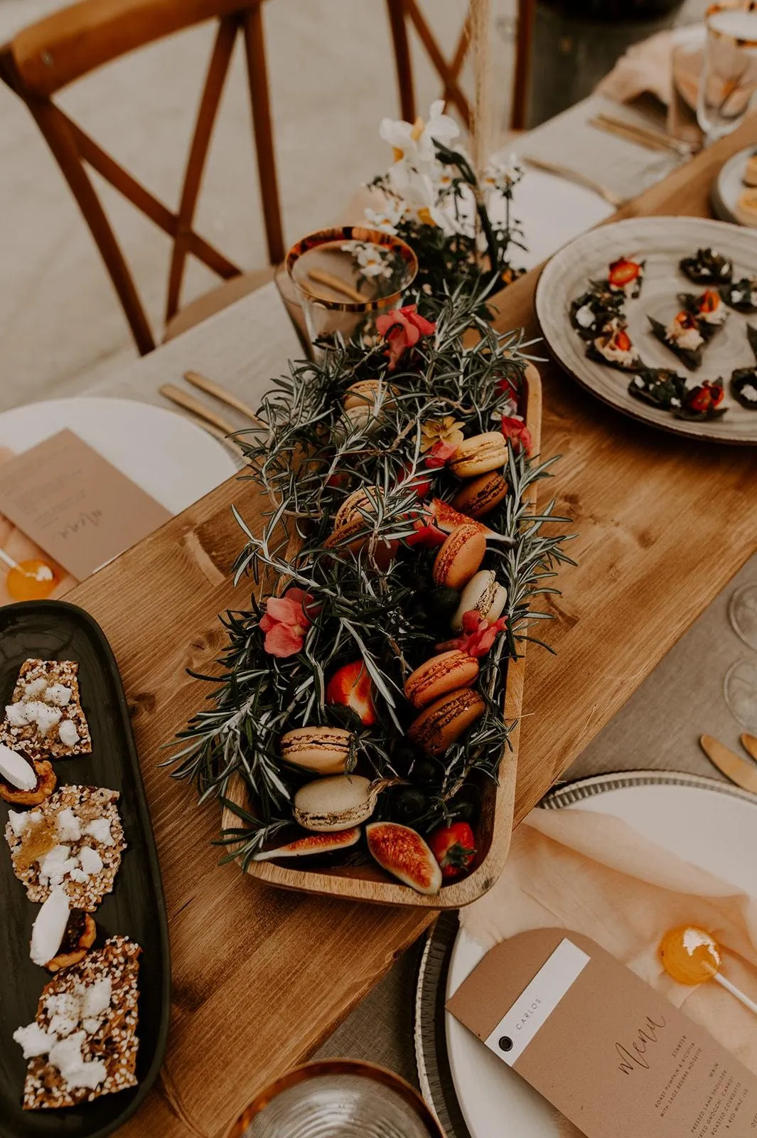 Grazing board with macarons and rosemary